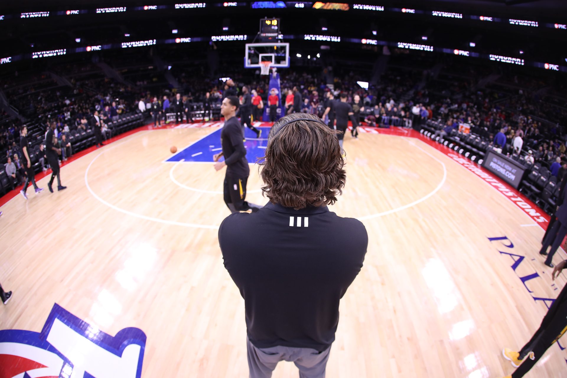 Sean Light on an NBA sideline before tip-off, a body at peak performance